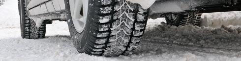 Winter tires on a vehicle in the snow