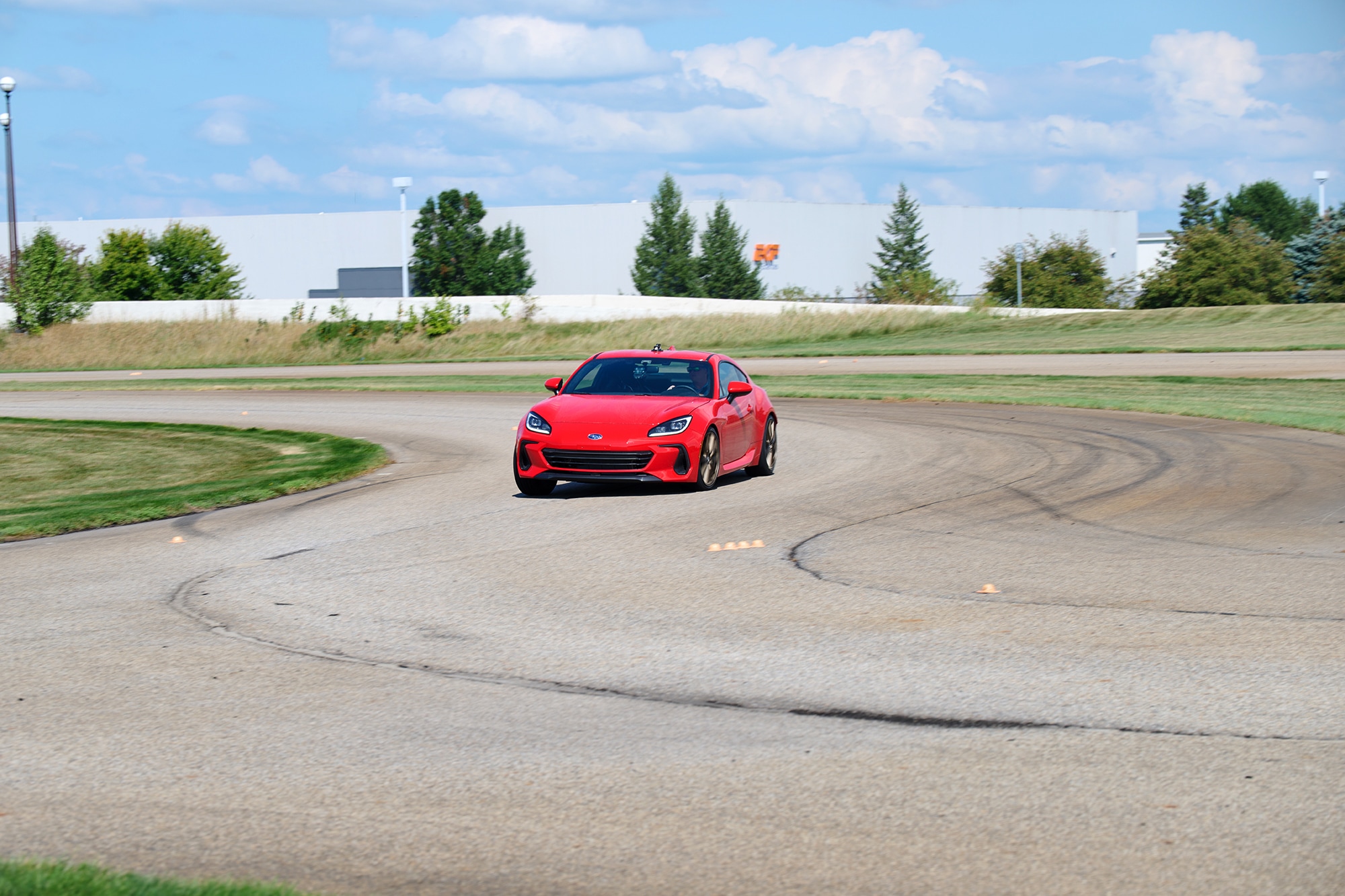 A red 2022 Subaru BRZ Limited conducting dry track testing