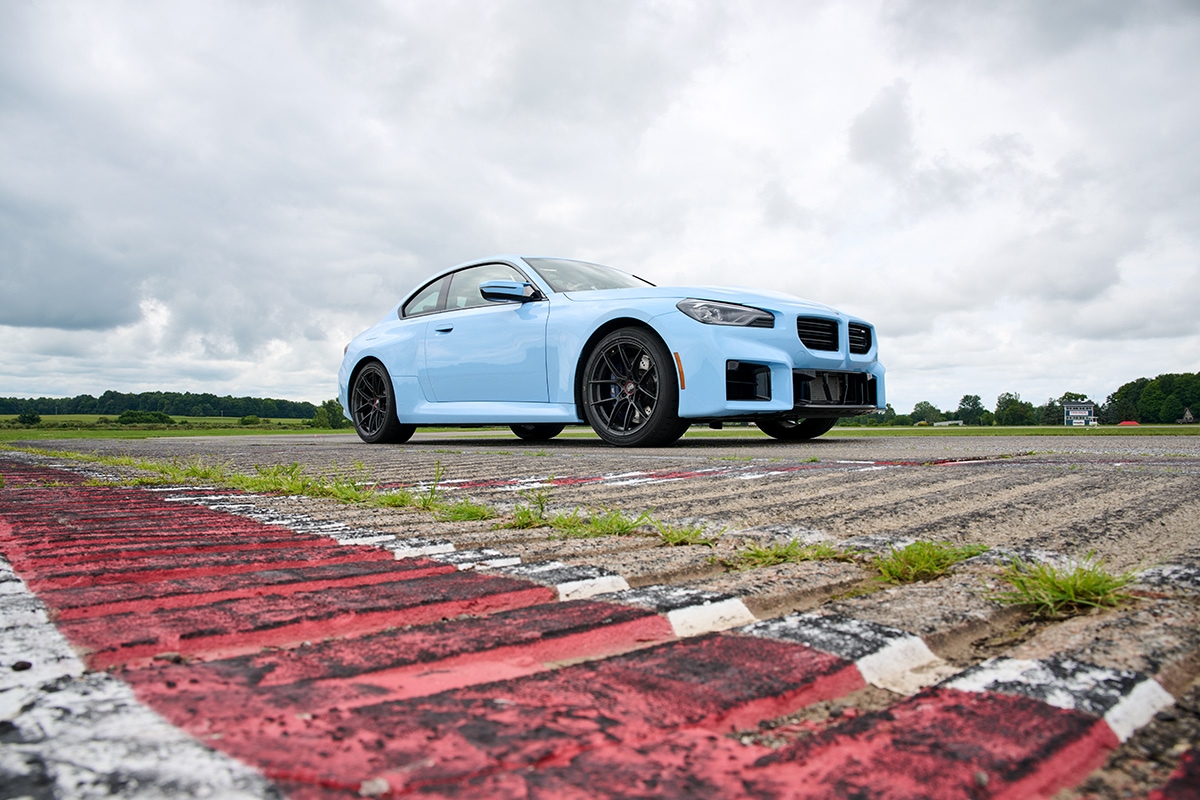 Light blue 2024 BMW M2 parked on the test track